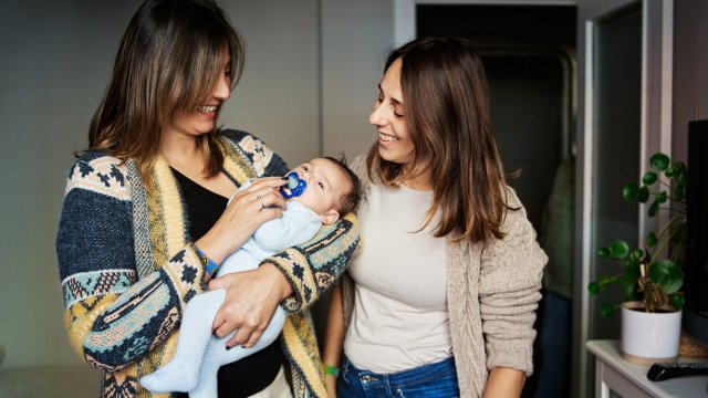 Article thumbnail: Happy caucasian woman visiting her sister and newborn son at home