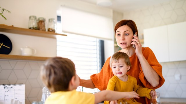 Article thumbnail: Stressed woman with son and daughter preparing breakfast.