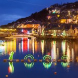 Article thumbnail: Beautiful display of Christmas Lights at Mousehole Harbour Cornwall England UK Europe