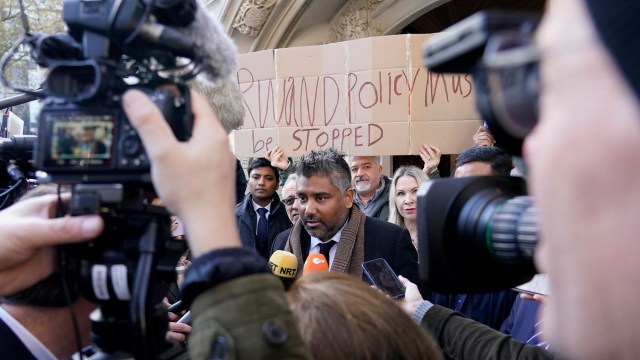 Article thumbnail: Lawyer Tofique Hossain addresses the media outside the Supreme Court in London. Britain's Supreme Court has ruled that the government's contentious plan to send some migrants on a one-way trip to Rwanda is illegal. (AP Photo/Alberto Pezzali)