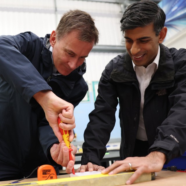 Article thumbnail: LONDON, ENGLAND - NOVEMBER 20: Britain's Prime Minister Rishi Sunak (R) and Britain's Chancellor of the Exchequer Jeremy Hunt do electrical work during a visit to a college in north London on November 20, 2023 in London, England. (Photo by Daniel Leal-WPA Pool/Getty Images)